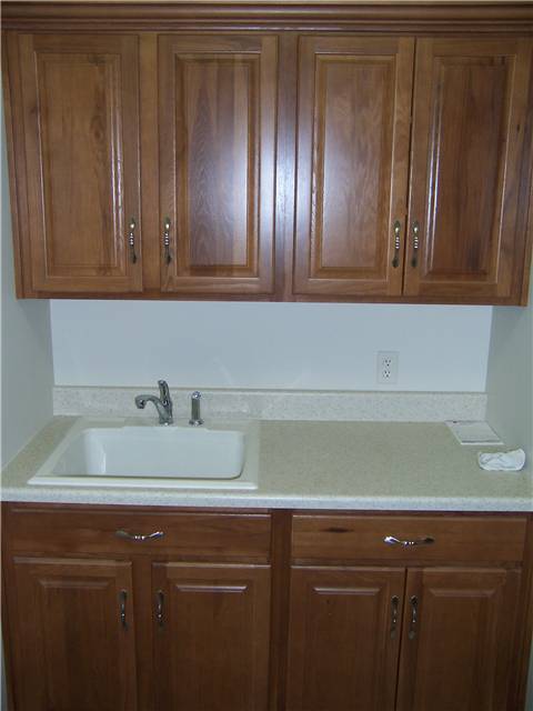 Hickory cabinets - laminate countertop - Drop-in utility sink